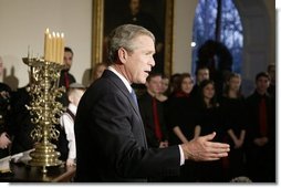President George W. Bush comments to the press after lighting the Menorah at the White House.